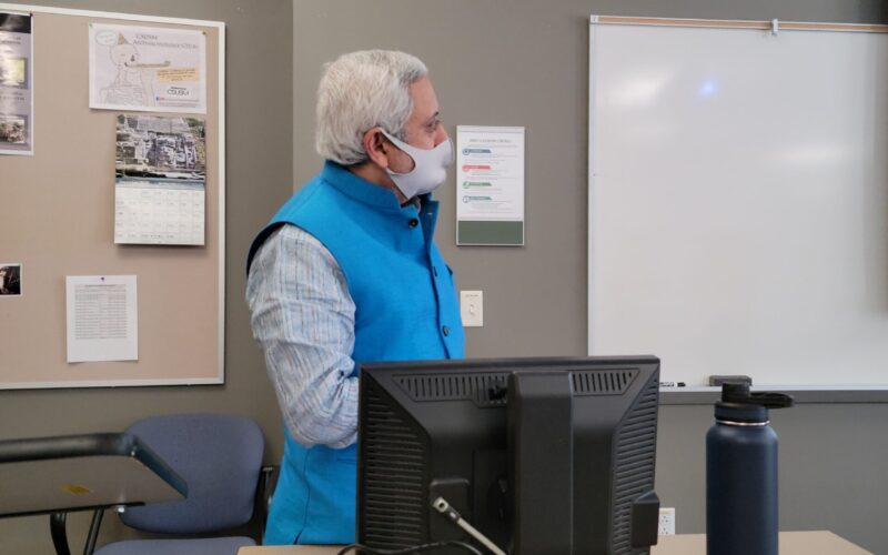 Vaidya Kamal speaking in a classroom